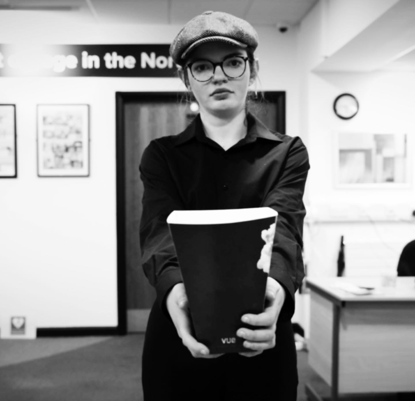 Still film from movie project Frame x Frame. Solo character holding out pop corn.