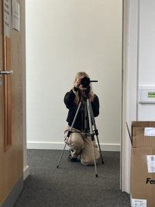 Mia filming with her camera