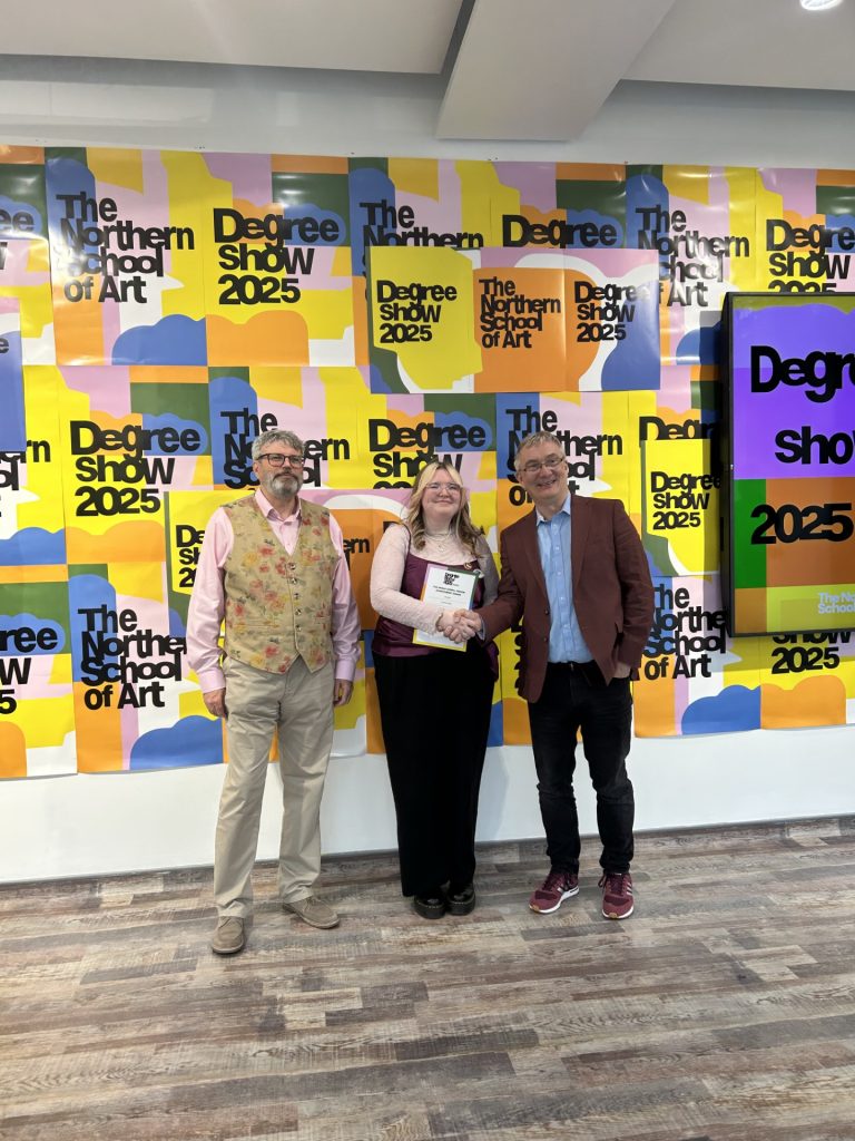 charlotte winning her award posed with principal and governors at the summer show